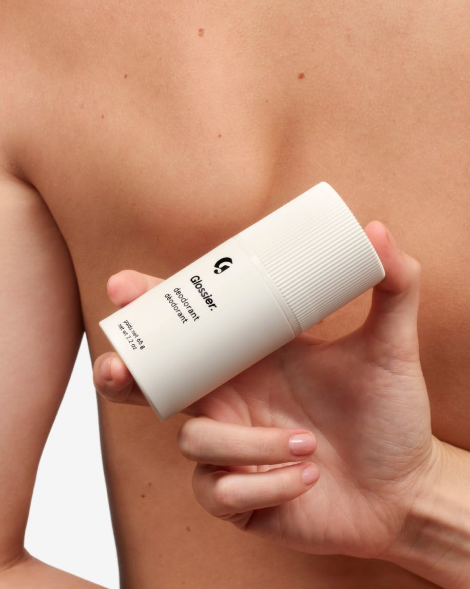 model holding deodorant refillable case