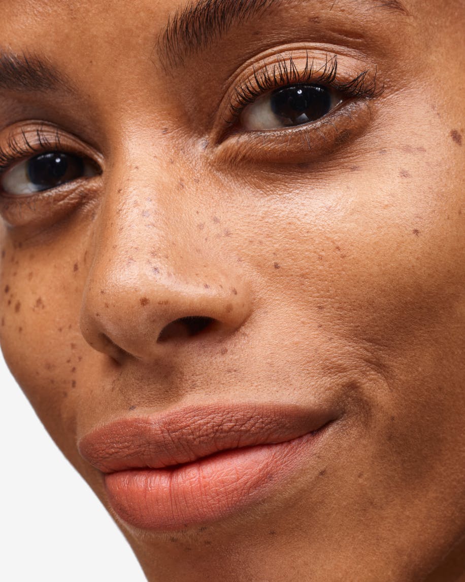 close up of model wearing cake