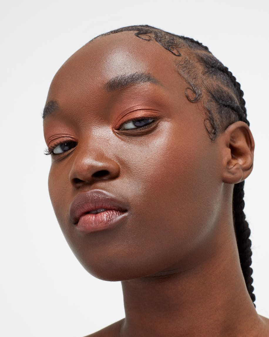 model wears monochromes in clay